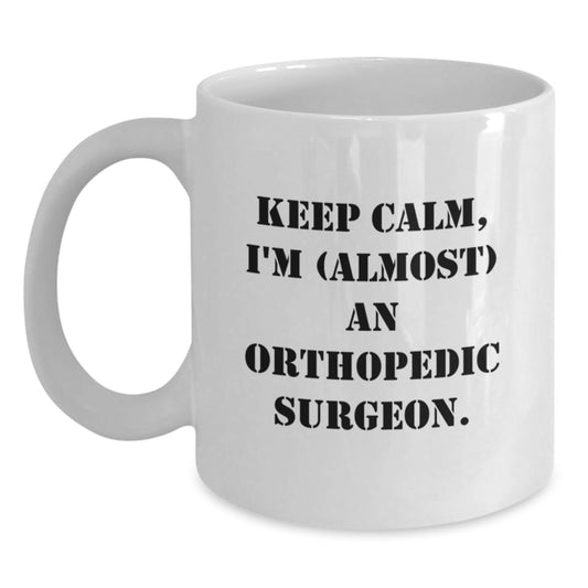 Orthopedic Surgeon Humor Gifts from Friends and Family, Keep Calm I'm (almost) An Orthopedic Surgeon. Birthday Unique Gifts for Orthopedic Surgeon, Funny White Coffee Mug - Main