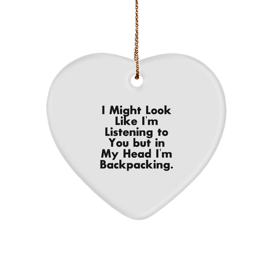 Funny Backpacking Heart Ornament Gifts from Friends for Christmas, Perfect for Men, Women, and Adventurers, 'I Might Look Like I'm Listening, But In My Head I'm Backpacking,',
   - Image 1