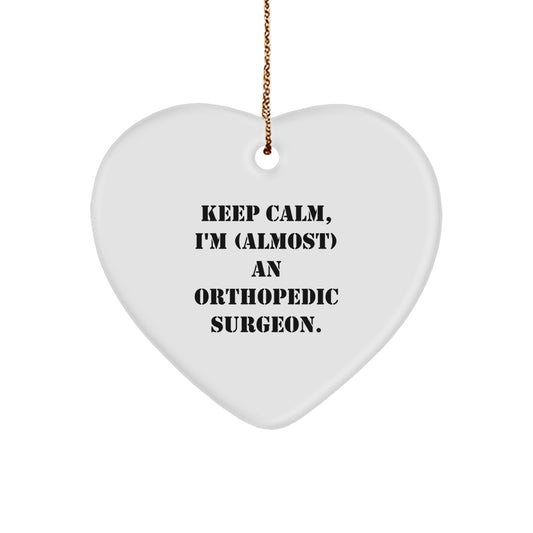 Orthopedic Surgeon Gifts, Funny Heart Ornament, 'Keep Calm, I'm (almost) An Orthopedic Surgeon.' - Gifts from Friends to Orthopedic Surgeon - Christmas Unique Gifts - Image 1