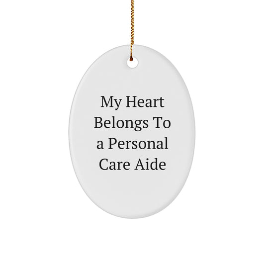 Funny Personal Care Aide Gifts For Christmas, Oval Ornament 'My Heart Belongs To A Personal Care Aide', Unique Gifts from Men to Women, Coworkers, Friends, Family - Image 1