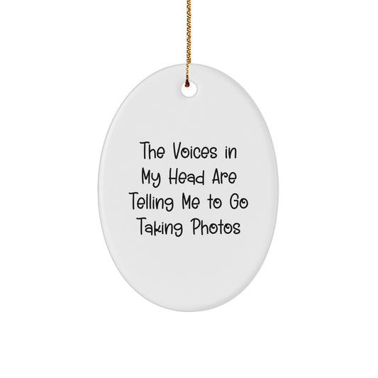 Funny Gift for Taking Photos Enthusiasts, Oval Ornament with The Voices In My Head Are Telling Me To Go Taking Photos Quote, Christmas Unique Gifts from Friends for Family - Image 1