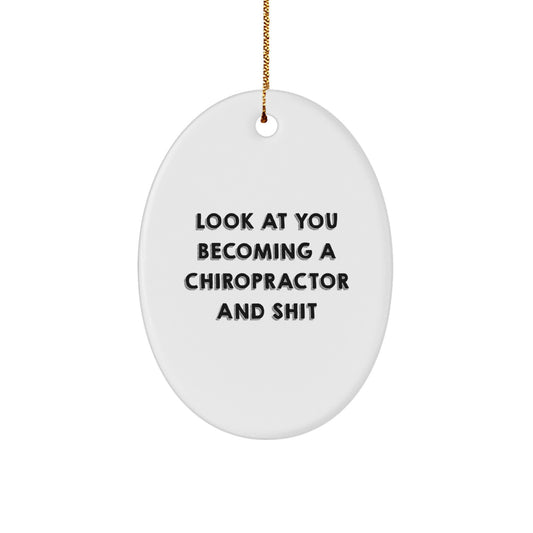 Funny Chiropractor Gifts - Oval Ornament for Chiropractor Friends - 'Look At You Becoming A Chiropractor And Shit' Christmas Unique Gifts from Men to Chiropractor - Image 1