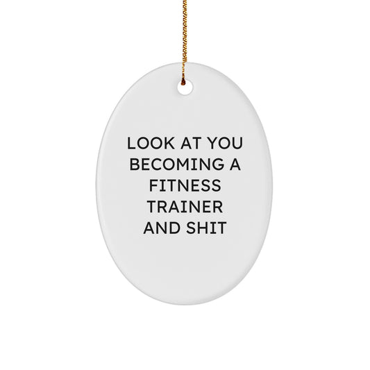 Funny Fitness Trainer Gifts from Friends - Christmas Unique Gifts for Fitness Trainers - Oval Ornament with 'Look At You Becoming A Fitness Trainer And Shit' - Image 1