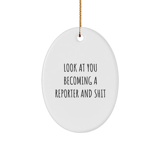 Funny Reporter Oval Ornament Gifts from Friends and Family for Christmas Unique Decorations, 'Look At You Becoming A Reporter And Shit', Oval Shaped White Color Christmas Unique Gifts - Image 1